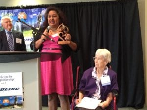 Solano-Huber accepting the “ChangeMaker” Award presented by Sister Georgette Bayless (seated).