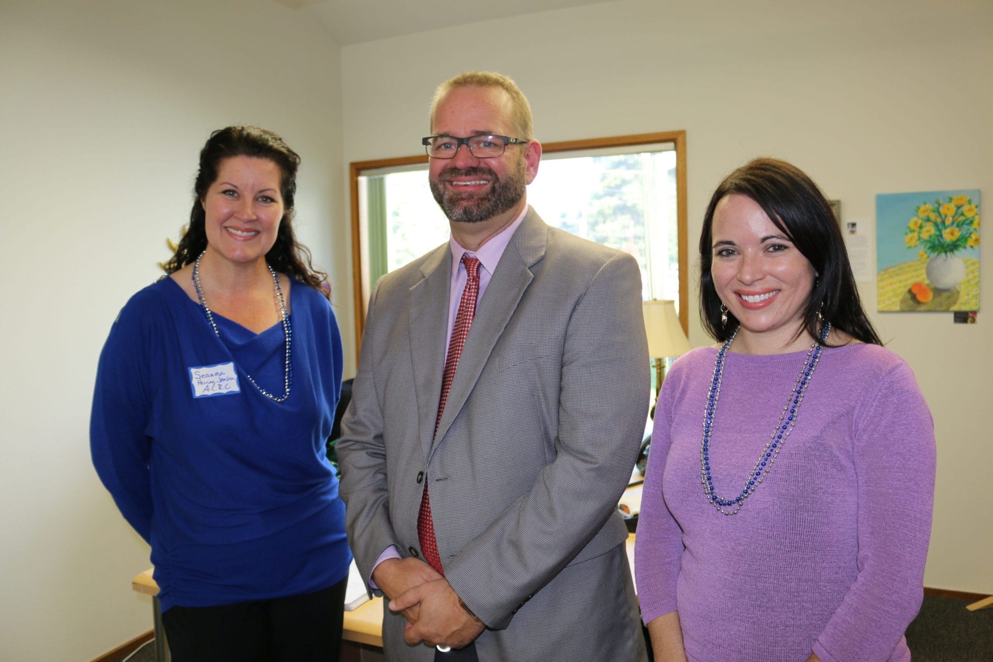 LCSNW staff and CEO present at the event discussed the future of the Arlington Community Resource Center. Left to right are Center Manager Seanna Herring-Jensen, CEO David Duea and Development Director Jaime Schilling.