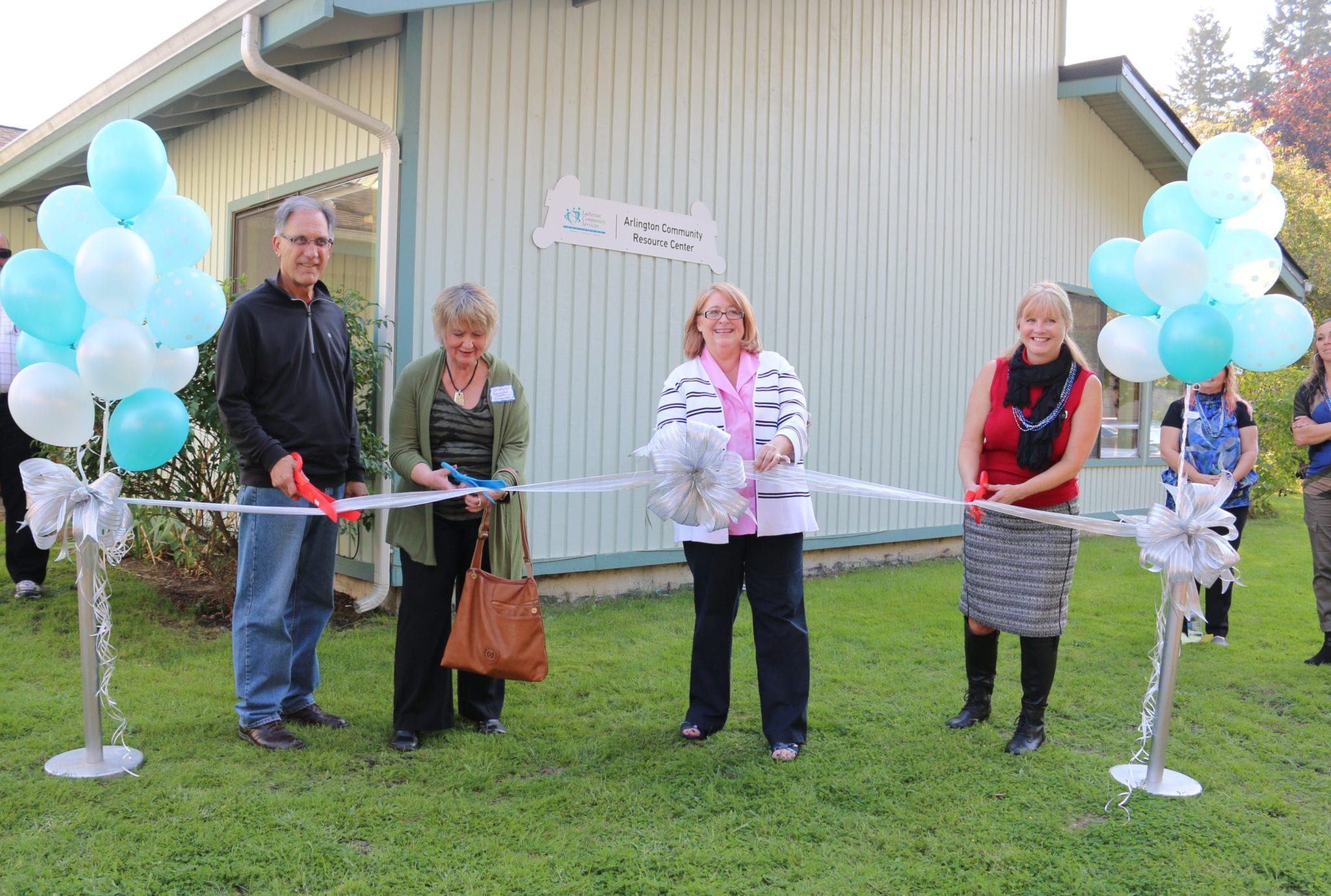 The ribbon cutting ceremony included Bill Tsoukalis (Executive Director of the Boys and Girls Club, Snohomish County), Jo Olson (Executive Director of the Stillaguamish Senior Center), Mayor Barbara Tolbert and LCSNW Family Support Center Director Crisann Brooks.