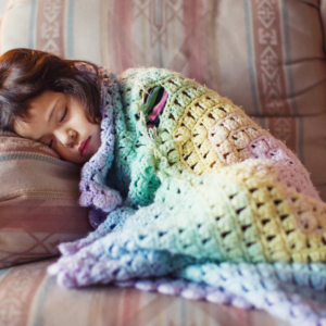 SFFC Child sleeping on a couch