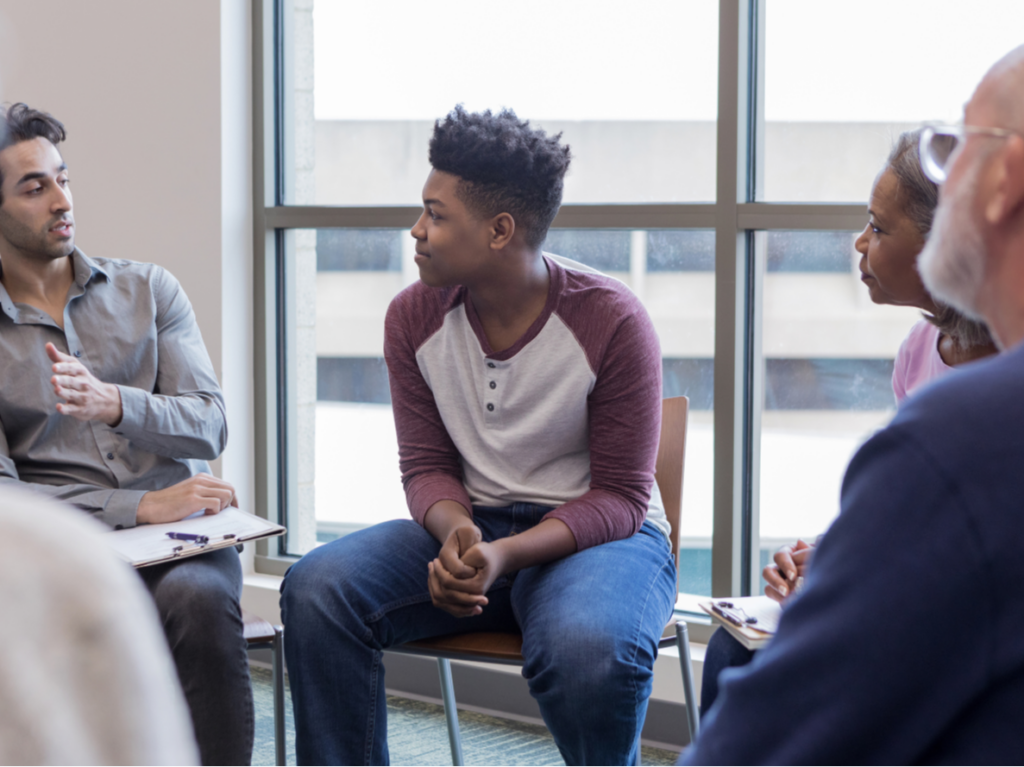 individuals participating in a group therapy session