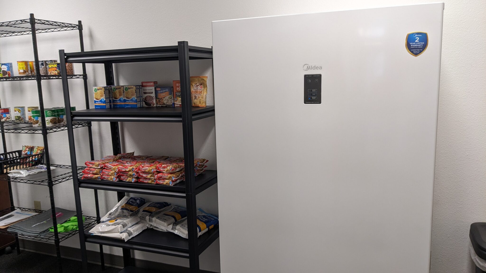 refrigerator and food pantry shelves in a room