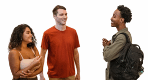 three teenagers smiling and talking together