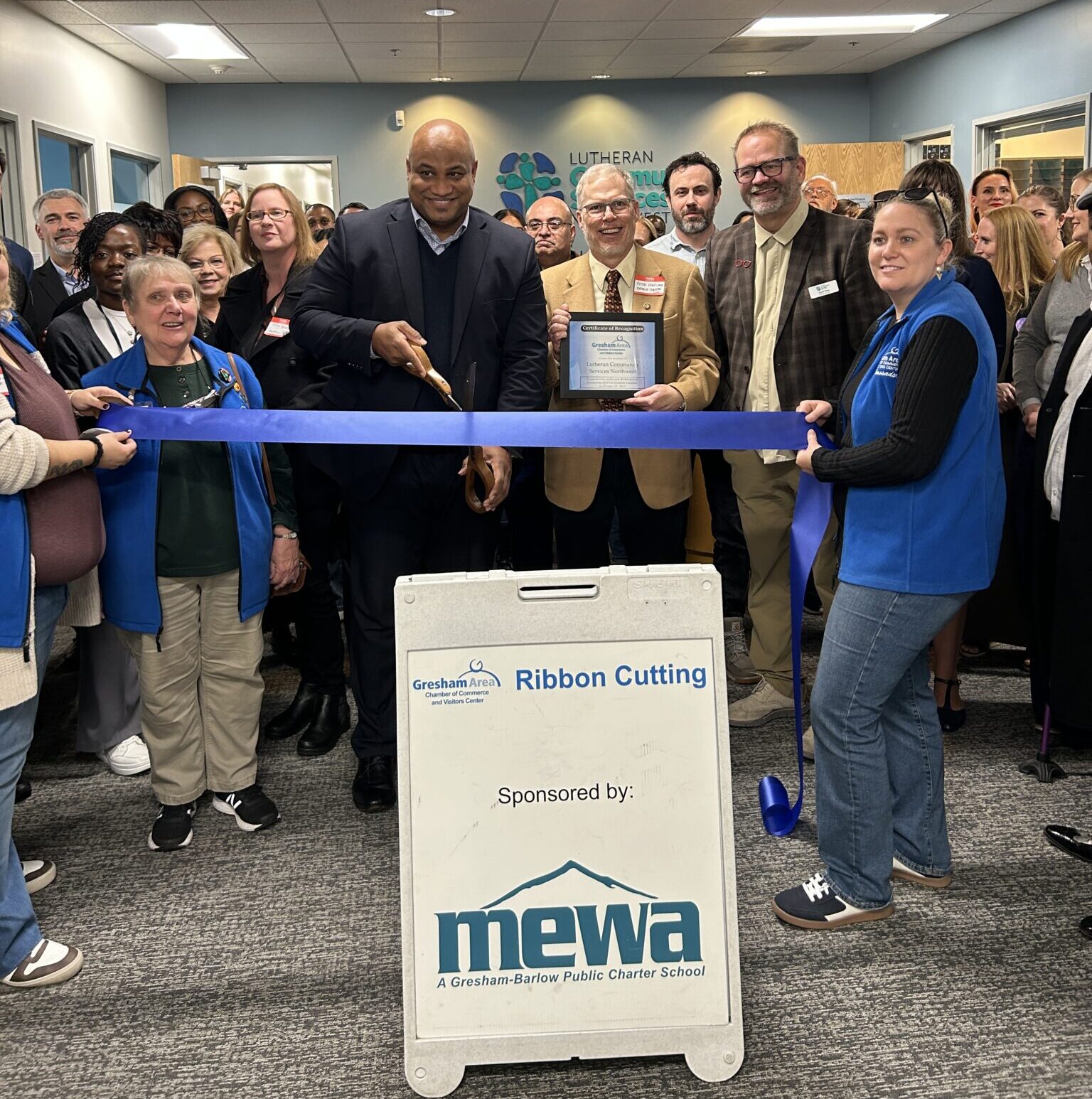 Two youth picking out school supplies at the free event
