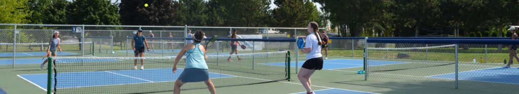 Pickleball players on a court