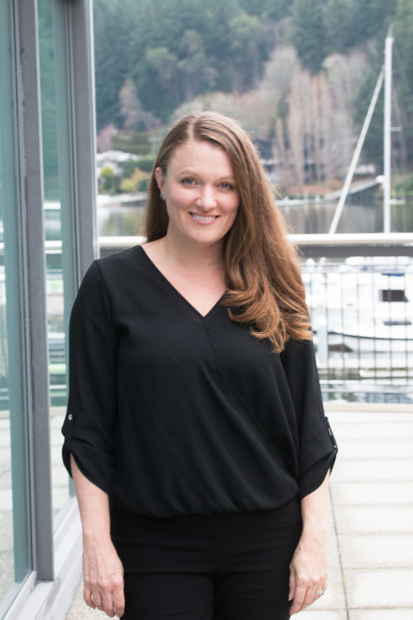 Husband and wife stand facing the Giving Machine vending machines