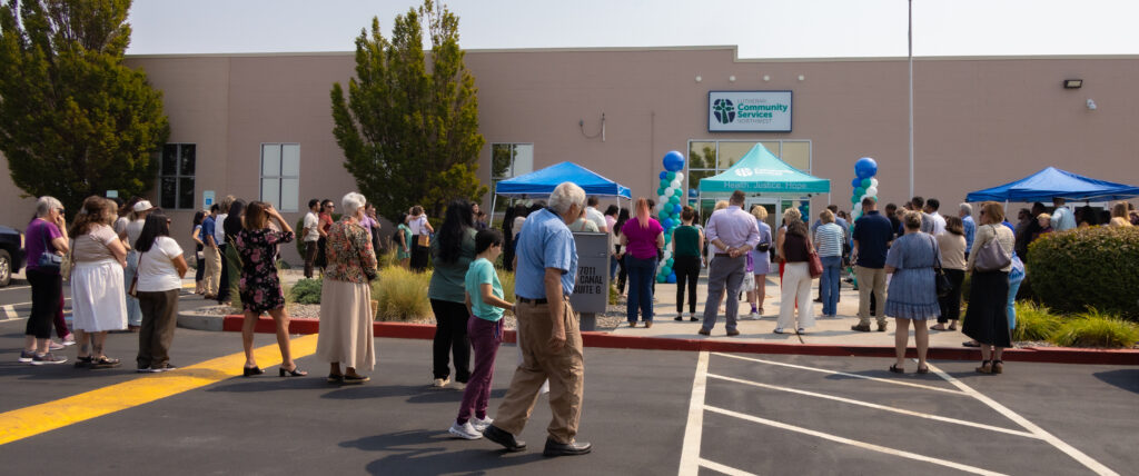 Community members gather at the front of the new LCSNW building in Kennewick